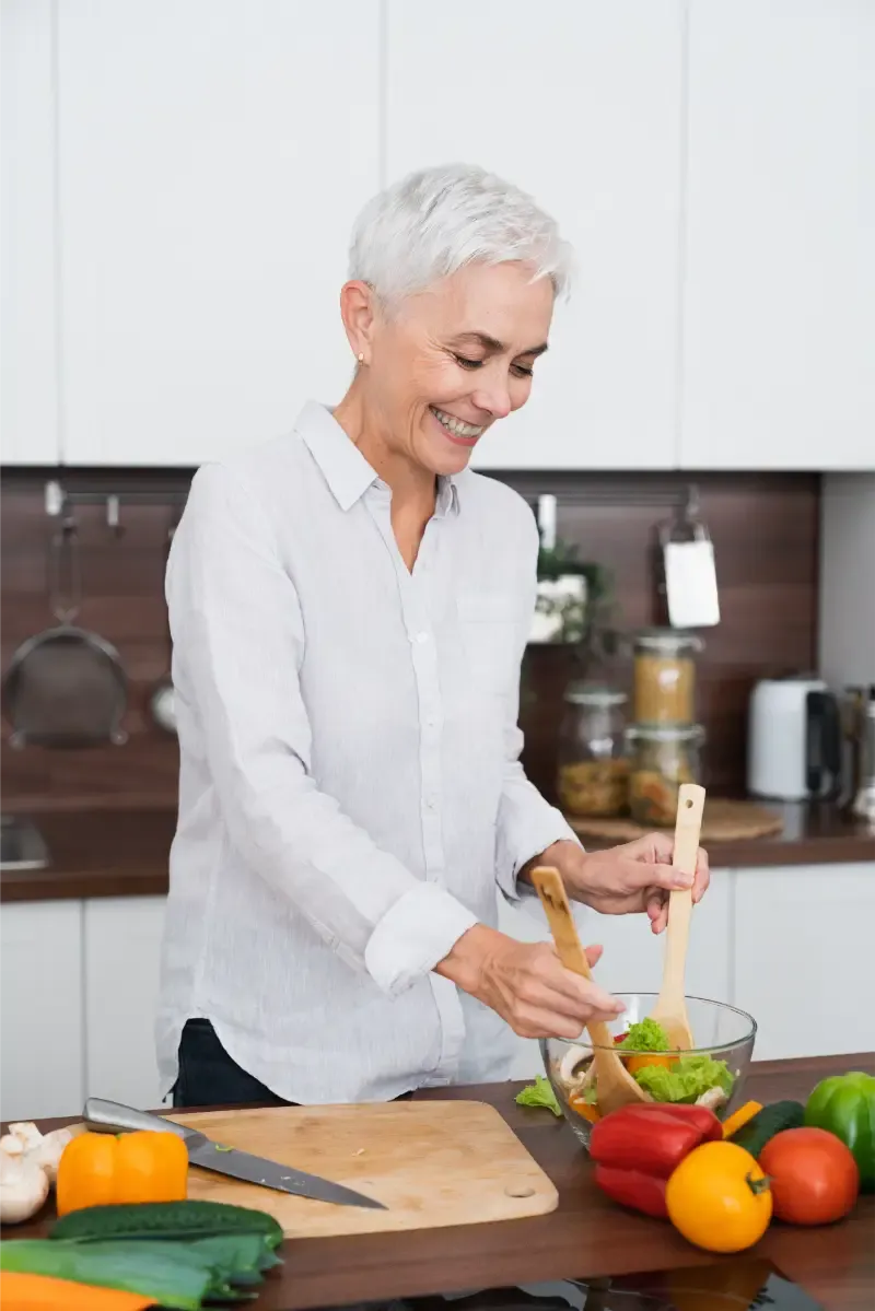 vertical shot of caucasian mature woman cooking ve 2025 01 09 06 25 48 utc